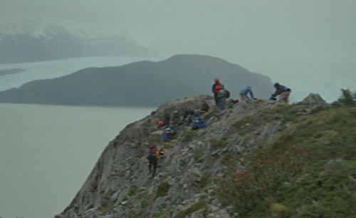 Our group takes a lunch break sheltered behind an outcrop; notice the Grey Glacier reaching out beyond them.